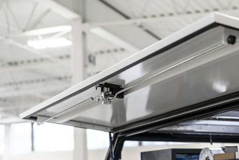 Close up of Adrian truck cap locking bar