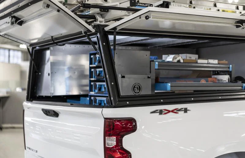 Adrian truck cap with back and side doors open