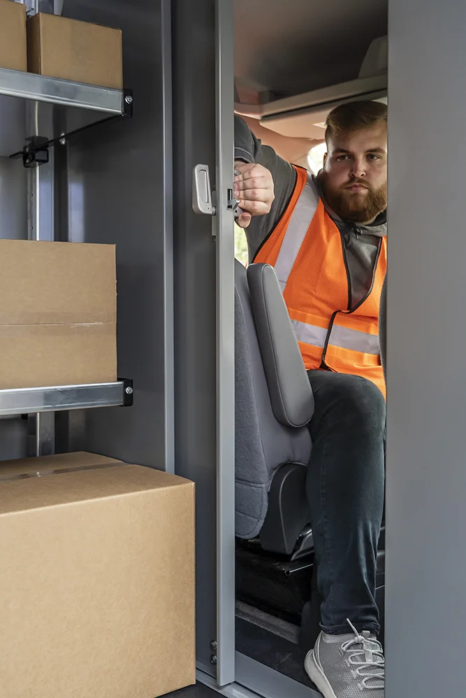 A sliding door van bulkhead partition mounted in place