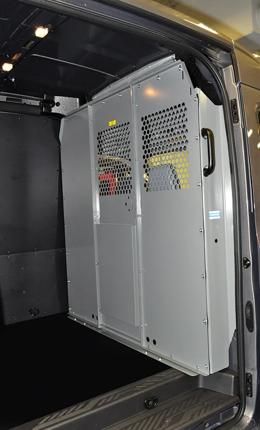 A steel van bulkhead partition mounted in place