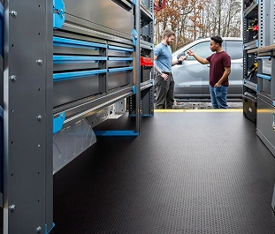 A utility van with new, shiny flooring in place