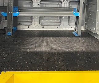 A utility van with mounted flooring in place