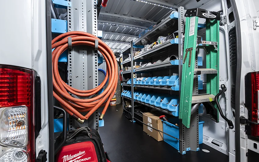 A van equipped with well-organized plumbing equipment